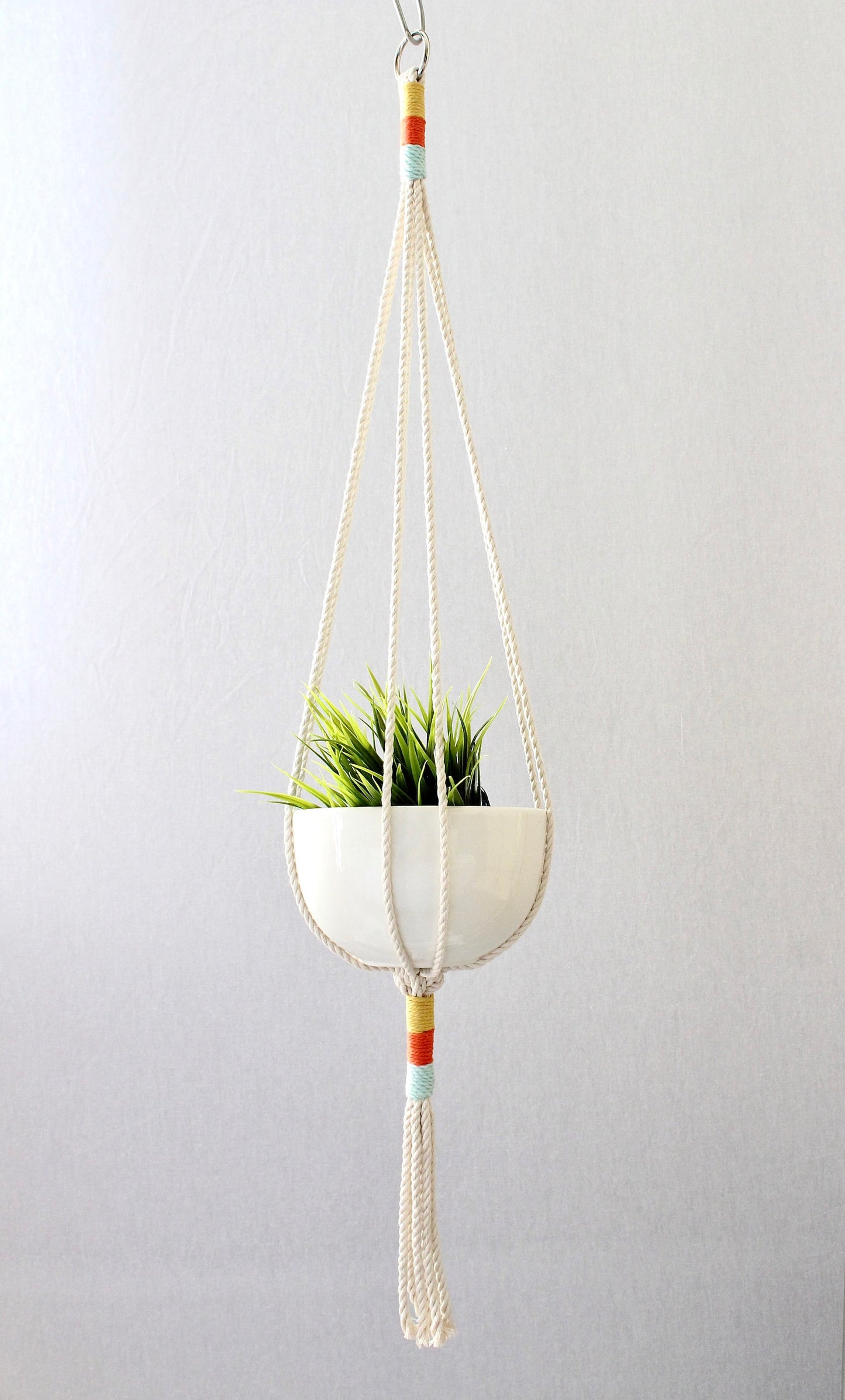 Macrame plant hanger with multi-colored wrapped accents, boho chic hanging planter, handmade cream cotton rope home decor made by Freefille