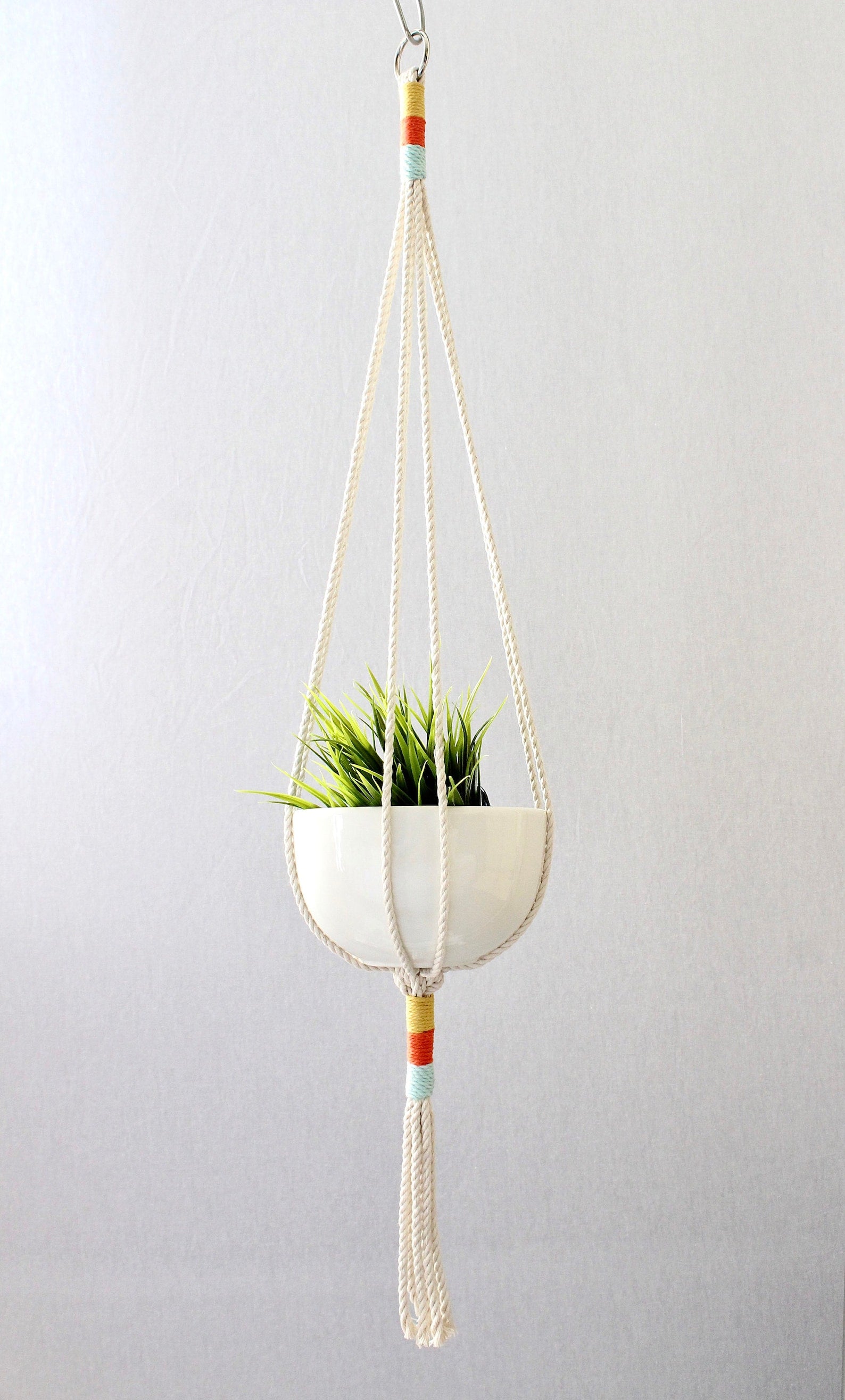 Macrame plant hanger with multi-colored wrapped accents, boho chic hanging planter, handmade cream cotton rope home decor made by Freefille