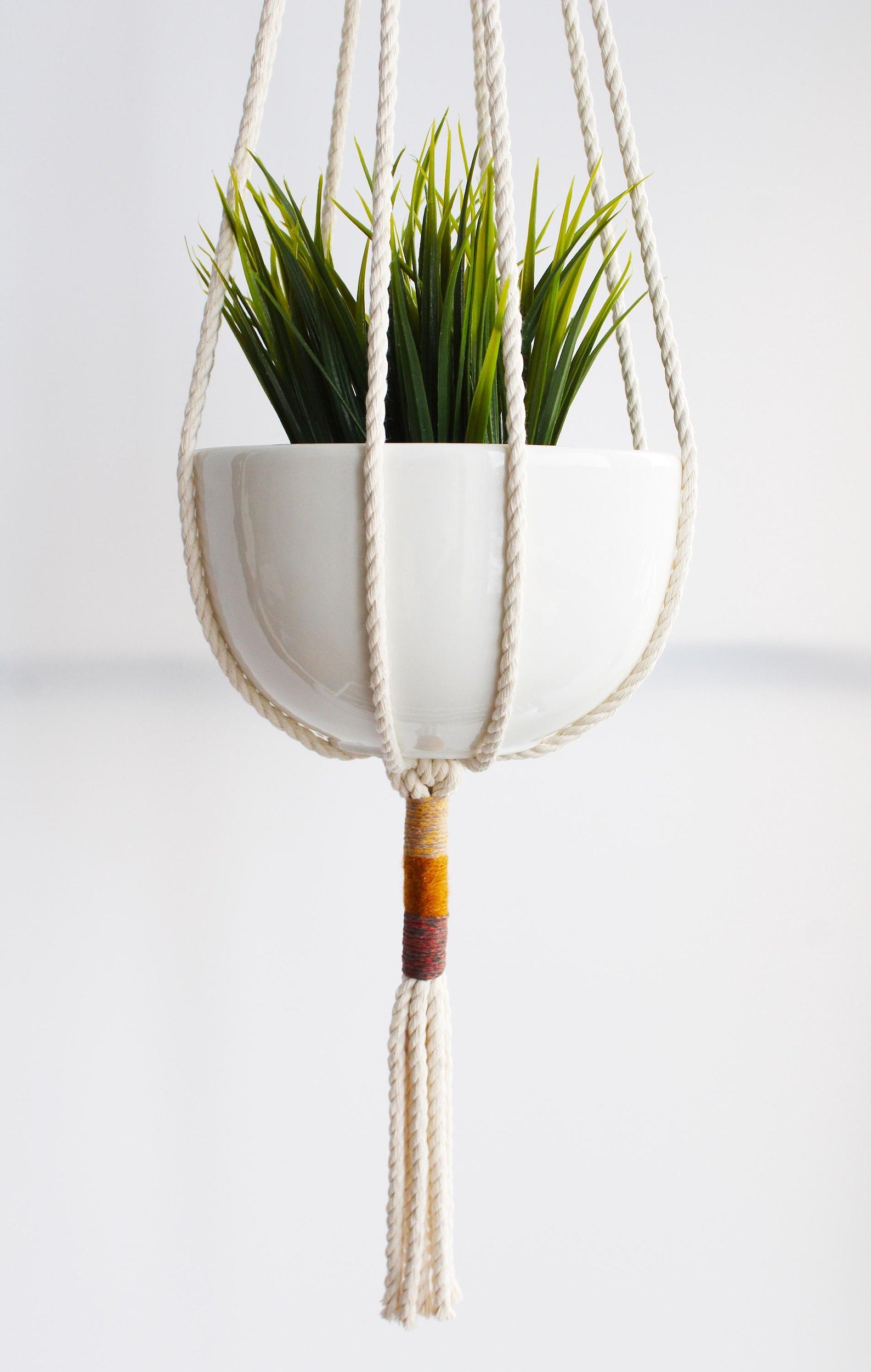 Macrame plant hanger with multi-colored wrapped accents, boho chic hanging planter, handmade cream cotton rope home decor made by Freefille