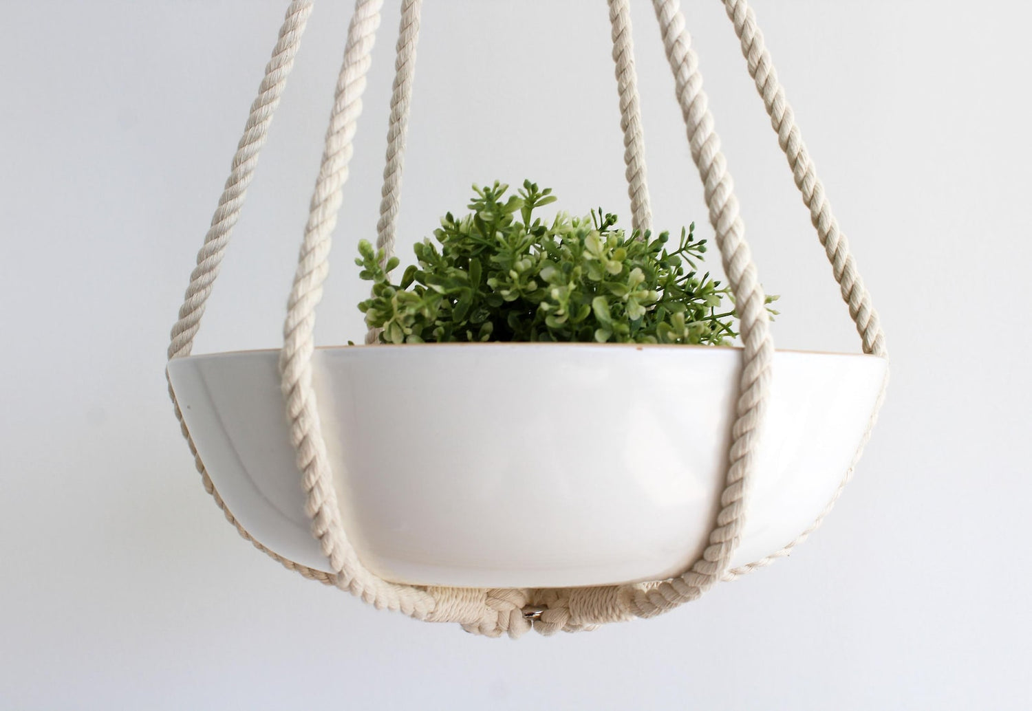 Tassel-free macrame plant hanger with mustard yellow, pink, orange wrapped top loop knot holding a white ceramic bowl by Freefille